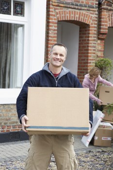Movers loading boxes for same day removals in London