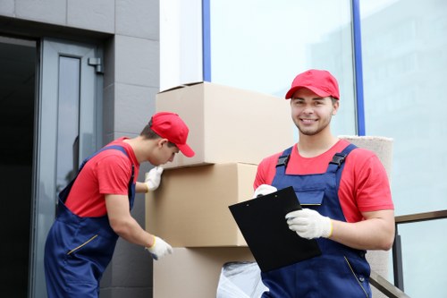 Moving boxes and furniture being prepared for a London home removal
