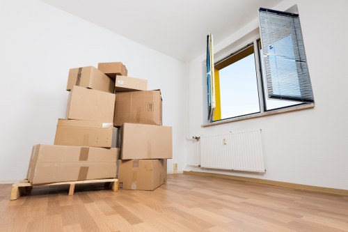 Boxes and furniture being loaded for a London apartment move