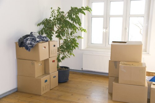 Stacked moving boxes and furniture prepared for transport