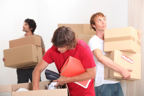Staff using protective packing materials during a removals job