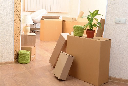 Van and man loading furniture for transport in London